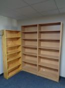 Two sets of beech effect bookshelves together with a pine effect shelf