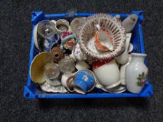 A basket of china and glass ware