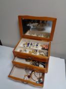 A jewellery chest of costume jewellery including dress rings and brooches etc.