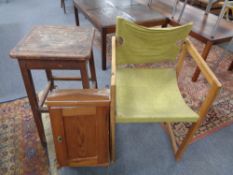 A pine single door cabinet together with a pine framed armchair and stool