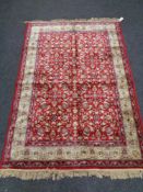 A red floral pattern kashmir rug 120 cm x 170 cm