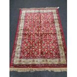 A red floral pattern kashmir rug 120 cm x 170 cm