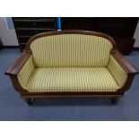 An early twentieth century settee in striped fabric