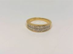An 18ct gold ring set with 22 princess cut diamonds, total diamond weight approximately 1.