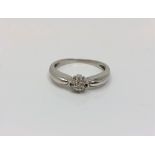 An 18ct white gold diamond cluster ring,