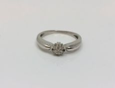 An 18ct white gold diamond cluster ring,