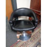 A gas lift barber's chair