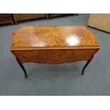 An inlaid French style coffee table with ormolu mounts