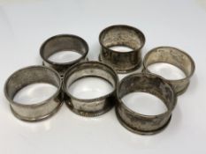 Six assorted silver napkin rings CONDITION REPORT: 73.