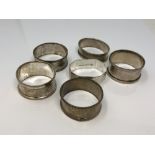 Six assorted silver napkin rings CONDITION REPORT: 82.