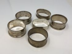 Six assorted silver napkin rings CONDITION REPORT: 82.