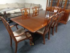 An eight piece mahogany Regency style dining room suite comprising of four drawer cabinet,