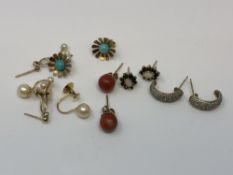 Six pairs of gold earrings; pearl, coral,