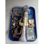 A tray of costume jewellery, Royal Engineers tie pin, metal thimbles, coins, one pound bank note.