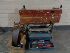A Black and Decker workmate together with tool box and heat gun,