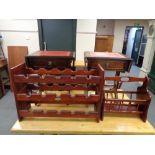 A pair of Regency style flap sided sofa occasional tables with magazine rack and wine rack