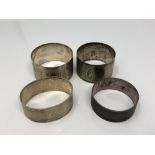 Four assorted silver napkin rings CONDITION REPORT: 76.
