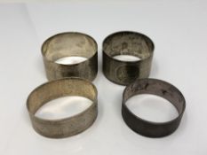 Four assorted silver napkin rings CONDITION REPORT: 76.