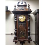 An early twentieth century Vienna wall clock with pendulum and key