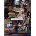 A pallet of Christmas decorations, wreaths, animated winter village,