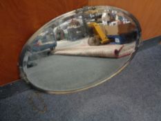 An oval Art Deco chrome framed bevelled mirror