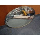 An oval Art Deco chrome framed bevelled mirror