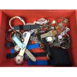 A box of replica and costume lady's and gent's wristwatches