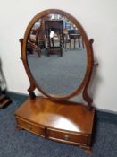 A mahogany dressing table mirror fitted with two drawers