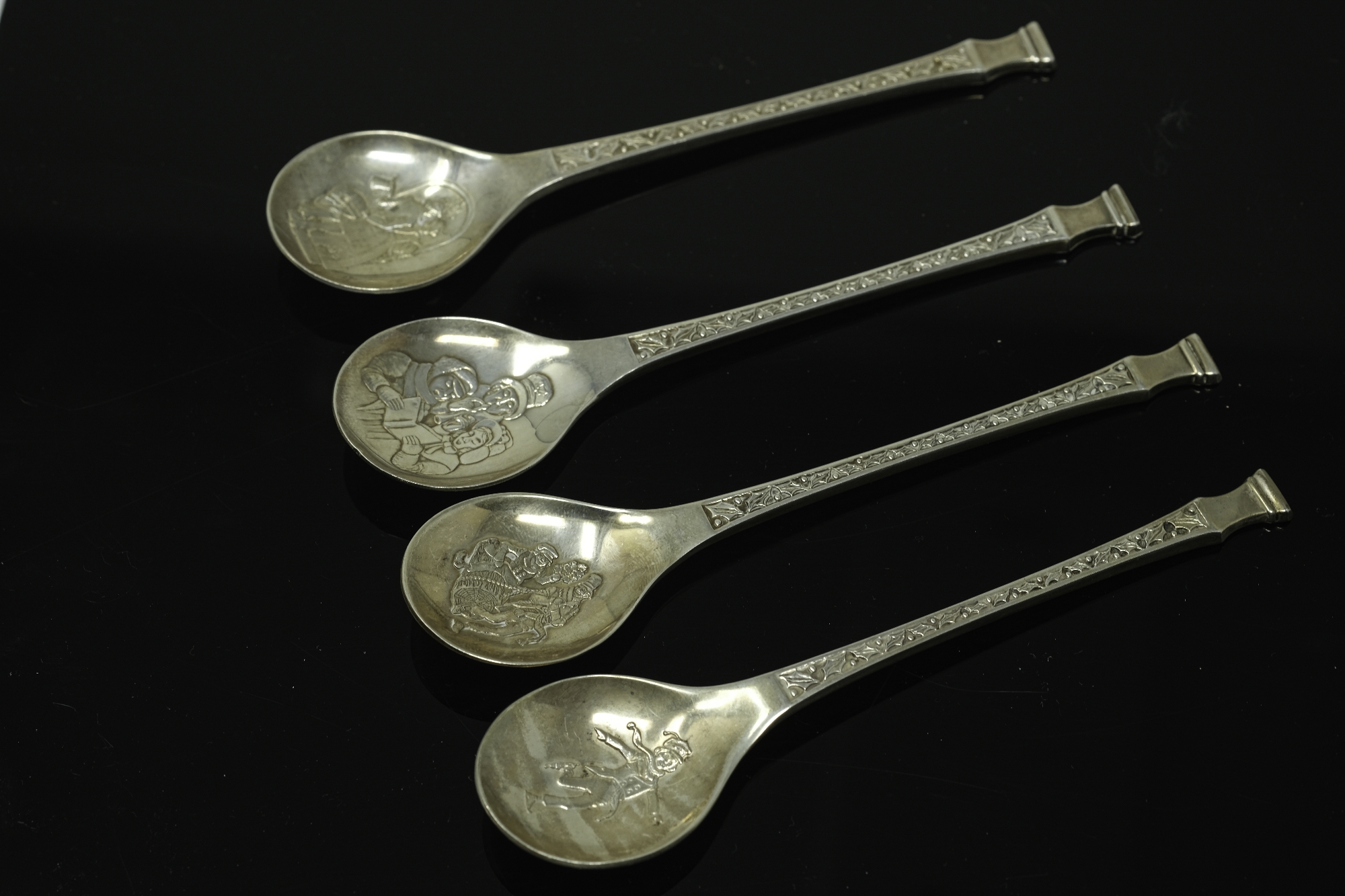 Three late twentieth century 'Christmas' spoons issued by the Franklin mint together with a