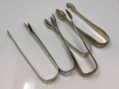 Five pairs of Georgian/Victorian silver sugar tongs (5) CONDITION REPORT: 219.