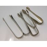 Five pairs of Georgian/Victorian silver sugar tongs (5) CONDITION REPORT: 219.