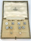A boxed set of 18ct gold diamond and mother of pearl cuff links and dress studs by Asprey