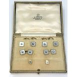 A boxed set of 18ct gold diamond and mother of pearl cuff links and dress studs by Asprey