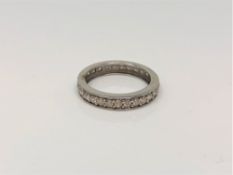 A white gold diamond half eternity ring, approximately 0.