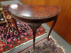 A mahogany demi lune hall table