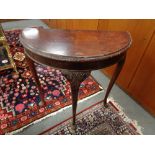 A mahogany demi lune hall table