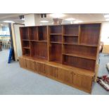 A mid century Danish twin sectioned bookcase fitted with cupboards beneath