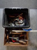 Two boxes of hand tools to include spirit levels, saws, clamps,