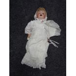 A Simon and Halbig porcelain headed doll with noise maker