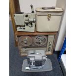 A cased Sanyo reel to reel stereo system and two vintage cased projectors