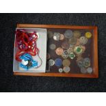 A box and counter display cabinet containing running and cycling medals