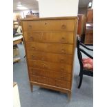 A mid century Danish teak seven drawer chest