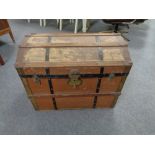 An early twentieth century wooden bound trunk