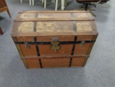 An early twentieth century wooden bound trunk