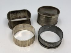 Four assorted silver napkin rings CONDITION REPORT: 85.