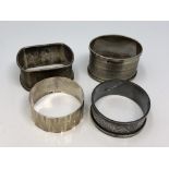 Four assorted silver napkin rings CONDITION REPORT: 85.