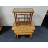 A nest of three oak tables together with a mid century tiled magazine rack