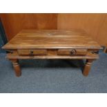 A Sheesham wood coffee table fitted with two drawers