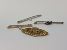Four gold brooches set with amethysts, garnet and pearls CONDITION REPORT: 8.