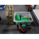 A box of Black and Decker hedge trimmer, two fuel cans,